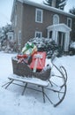 Sleigh filled with Christmas gifts on a snowy day