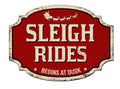 Sleigh rides vintage rusty metal sign
