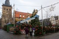 Jumping deer pull a sleigh above the entrance to the Christmas market. Small Christmas fair on historic square Ratingen, Germany.