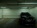 Sleman August 4, 2022. View of the parking space inside the building and a parked Nissan car. Royalty Free Stock Photo