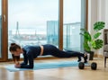 Slender brunette does exercise in plank position on blue mat