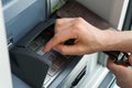 Female hand entering a secure PIN code at a cash point or ATM up close and in detail Royalty Free Stock Photo