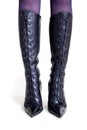Slender female legs in high leather boots front view Royalty Free Stock Photo