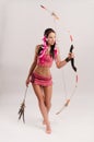 Slender girl in an Amazon costume with a bow and arrow in her hands Royalty Free Stock Photo