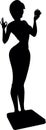 A slender girl with an apple in her hand is weighed on the scales. Shows language.Cartoon. Silhouette.