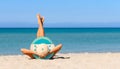 A slender girl on the beach in a straw hat in the colors of the flag of Honduras flag.