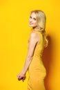 Slender girl in a yellow dress