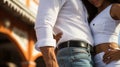 Slender Latin American couple in white casual clothes, holding each other close and dancing on the street. Generative AI Royalty Free Stock Photo