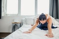 Slender sporty woman doing exercises on bed at home Royalty Free Stock Photo