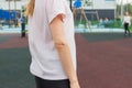 Slender woman scar on hand gymnastics outdoor