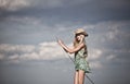 Young blonde girl fishing in lake Royalty Free Stock Photo