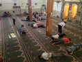 People resting inside a muslim mosque Royalty Free Stock Photo