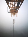 Slewing crane in the fog Royalty Free Stock Photo