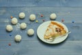 Slice of apple pie and coconut candies Royalty Free Stock Photo