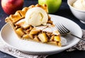 A slice of apple pie with a scoop of vanilla ice cream. Royalty Free Stock Photo