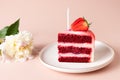 Slice of birthday cake with candle and peony flowers Royalty Free Stock Photo