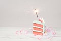 Slice of Birthday Cake with sparkler Royalty Free Stock Photo