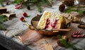 Slice of biscuit sponge cake with white cream and cherry sauce inside on copper vintage plate Royalty Free Stock Photo