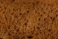 Slice of black bread in a cut macro photo Royalty Free Stock Photo