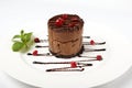 A slice of black chocolate cake with red cherry