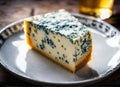 Slice of blue cheese or Roquefort on a plate