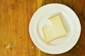 Slice bread bite on white plate Royalty Free Stock Photo