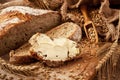 Slice of bread with butter on wooden board Royalty Free Stock Photo