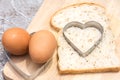 Slice of bread with cut out heart shape Royalty Free Stock Photo