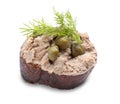 Slice of bread with delicious pate, capers and dill isolated on white Royalty Free Stock Photo