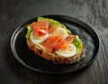 Slice of bread with egg and salmon Royalty Free Stock Photo