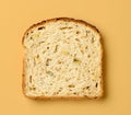 slice of bread on orange background Royalty Free Stock Photo
