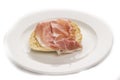 Slice bread with parma ham on white plate Royalty Free Stock Photo