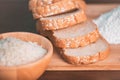 Slice bread rice and flour on wooden cutting board. Nutritious of fiber food and Carbohydrates ingredient concept Royalty Free Stock Photo