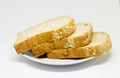 Slice of breads on the white disc isolate background Royalty Free Stock Photo
