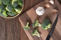 Slice of broccoli on wood cutting board. Royalty Free Stock Photo