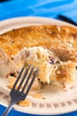 Slice of burek on the fork with blurred background