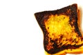 Slice of burnt toast isolated white Royalty Free Stock Photo