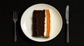 A slice of cake with chocolate and orange layers on a white plate. Royalty Free Stock Photo