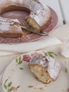 Slice of cake `Ciambellone` with crumbs on ceramic plate painted with floral motifs Royalty Free Stock Photo