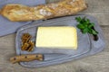 Slice of Cantal cheese on a table