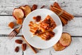 Slice of autumn caramel apple pecan cheesecake, top view with frame of ingredients over white wood Royalty Free Stock Photo