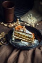 Slice of carrot cake with cream cheese and walnuts. The restaurant or cafe atmosphere. Vintage Royalty Free Stock Photo