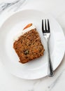 Slice of carrot cake on plate Royalty Free Stock Photo