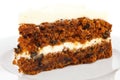 Slice of carrot cake with rich frosting. Royalty Free Stock Photo