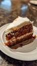 Slice of carrot cake on a white plate Royalty Free Stock Photo