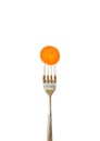 Slice of carrot pinned on a fork Royalty Free Stock Photo