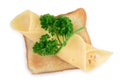 Slice of cheese bandaged by twig of green parsley on a toast, isolated on white background, top view Royalty Free Stock Photo