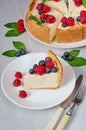 Slice of cheesecake with fresh berries on the white plate close up - healthy organic dessert. Classic New York cheese cake Royalty Free Stock Photo