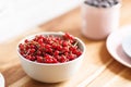 Plate with red currant on thw wooden table Royalty Free Stock Photo