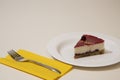 A slice of cheesecake on a white plate Royalty Free Stock Photo